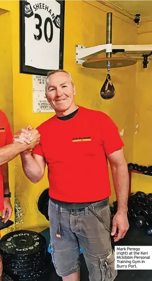  ?? ?? Mark Perego (right) at the Keri Mckibbin Personal Training Gym in Burry Port.