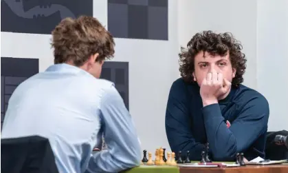  ?? Crystal Fuller/Saint Louis Chess Club ?? Hans Niemann (right) has admitted cheating earlier in his career but denies he cheated to beat Magnus Carlsen this month. Photograph: