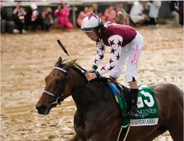  ?? (AP Photo/jeff Roberson) ?? Brian Hernandez Jr. rides Thorpedo Anna to win the 150th running of the Kentucky Oaks horse race Friday at Churchill Downs in Louisville, Ky.
