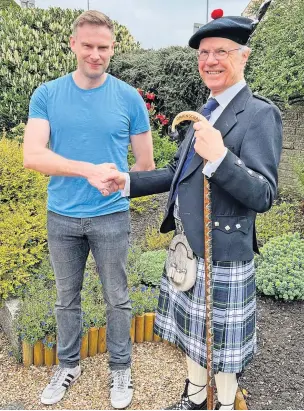  ?? ?? Support Paul Dearie with Shotts Highland Games chairman Robert Williams