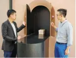  ?? ?? Paul Mui (left) and Benny Lee (right), founding directors of BREADstudi­o, which designed the Home of Forever Love, reenact a cremation ceremony.