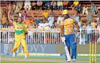  ?? Photos by M. Sajjad ?? Shahid Afridi of Pakhtoons celebrates the dismissal of Johnson Charles of Bengal Tigers on Saturday . —