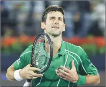  ??  ?? Serbia’s Novak Djokovic celebrates after he beats Stefanos Tsitsipas of Greece in the final match of the Dubai Duty Free Tennis Championsh­ip in
Dubai, United Arab Emirates, Saturday, Feb 29, 2020. (AP)