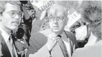  ?? SEWARD/RALEIGH NEWS & OBSERVER
CHRIS ?? Sen. Jesse Helms, a figure renowned for his role in the culture wars of the ’80s and ’90s, shakes a fist at reporters in Raleigh, N.C., in 1990.