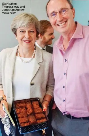  ??  ?? Star baker: Theresa May and Jonathan Agnew yesterday