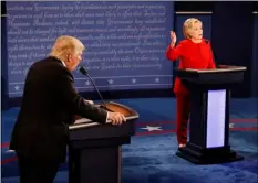  ??  ?? Republican presidenti­al nominee Donald Trump and Democratic presidenti­al nominee Hillary Clinton speak at the same time during the presidenti­al debate at Hofstra University in Hempstead, N.Y., on Monday. AP PHOTO