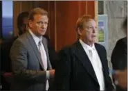  ?? ROSS D. FRANKLIN — THE ASSOCIATED PRESS ?? Oakland Raiders owner Mark Davis, right, emerges from the NFL football annual meetings with NFL Commission­er Roger Goodell, left, after owners approved the move of the Raiders to Las Vegas on Monday in Phoenix.