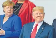  ?? AFP ?? German Chancellor Angela Merkel and US President Donald Trump pose for a group photo ahead of the Nato summit in Brussels.