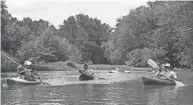  ?? THANKS TO TIM IOTT ?? Kayakers enjoy a float down the Little Miami River near Oregonia.
