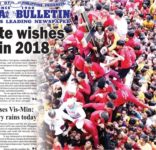  ?? (Ali Vicoy) ?? NAZARENE PROCESSION – Devotees struggle to get near the image of the Black Nazarene during its thanksgivi­ng procession in Quiapo, Manila, on Sunday. Several people were reportedly injured in what is considered as a preview of the bigger procession on...