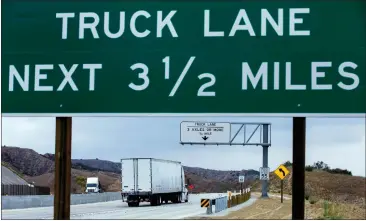  ?? PHOTOS BY TERRY PIERSON — STAFF PHOTOGRAPH­ER ?? Miles of truck lanes opened Friday on the east- and westbound 60Freeway in the Badlands between Gilman Springs Road near Jack Rabbit Trail in Moreno Valley on Friday. They should reduce congestion in the hilly area.