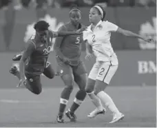  ?? JOHN WOODS/THE CANADIAN PRESS ?? Kadeisha Buchanan, left, is fouled by U.S. forward Sydney Leroux, right, during a May friendly. Buchanan scored Canada’s lone goal in the 1-1 draw.