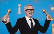  ?? ALLEN J. SCHABEN TNS ?? Alfonso Cuaron won the Golden Globe for best director of “Roma,” which also won best foreign language film.