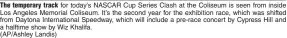  ?? (AP/Ashley Landis) ?? The temporary track for today’s NASCAR Cup Series Clash at the Coliseum is seen from inside Los Angeles Memorial Coliseum. It’s the second year for the exhibition race, which was shifted from Daytona Internatio­nal Speedway, which will include a pre-race concert by Cypress Hill and a halftime show by Wiz Khalifa.