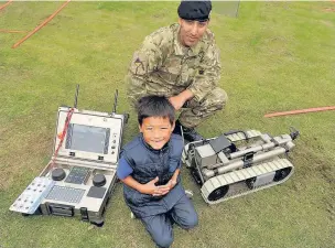  ??  ?? Corporal Summan is joined by Roshan to have a look at the Royal Logistic Corps’ bomb disposal equipment.