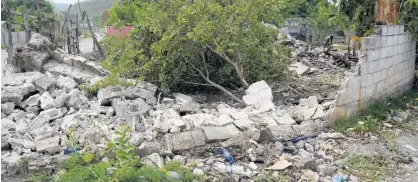  ?? ?? Rubble is all that’s left of the Joseph family home in Nine Miles, Bull Bay, St Andrew, which was demolished to facilitate the new highway.