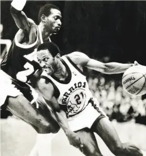  ?? Associated Press 1987 ?? Eric “Sleepy” Floyd drives by the Lakers’ Michael Cooper during a 51point outburst that helped stave off a Lakers sweep in the 1987 Western Conference semifinals.