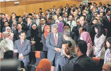  ??  ?? Zahid (centre) greeting guests attending the Intan Public Policy Ministeria­l Forum Series 2017. — Bernama photo