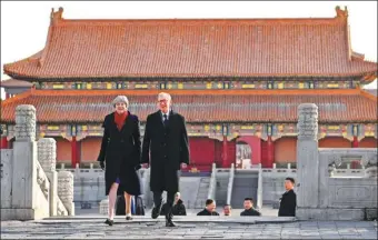  ?? JIN LIANGKUAI / XINHUA ?? British Prime Minister Theresa May and her husband, Philip May, visit the Palace Museum in Beijing on Thursday.