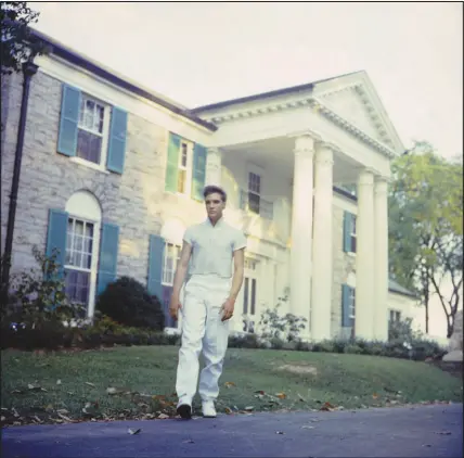  ?? ?? Elvis Presley walks outside Graceland in Memphis, Tenn., in this undated photo.