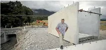  ?? PHOTO: VIRGINIA WOOLF/STUFF ?? Cr Stuart Bryant in front of a culvert extension that looks likely to remain in the same spot over winter – beside its final destinatio­n.