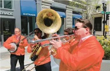  ?? STEVE LEBLANC/AP ?? Dan Gabel, right, and fellow musicians perform May 10 in Boston. Gabel has canceled Netflix and other streaming services and tried to cut back on driving as the costs of gas, food and other items, such as the lubricants he uses for his instrument­s, have soared.