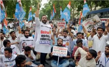  ?? — BIPLAB BANERJEE ?? NSUI activists raise slogans against Union HRD minister Prakash Javedkar during a protest over various issues at Shastri Bhavan in New Delhi on Wednesday.