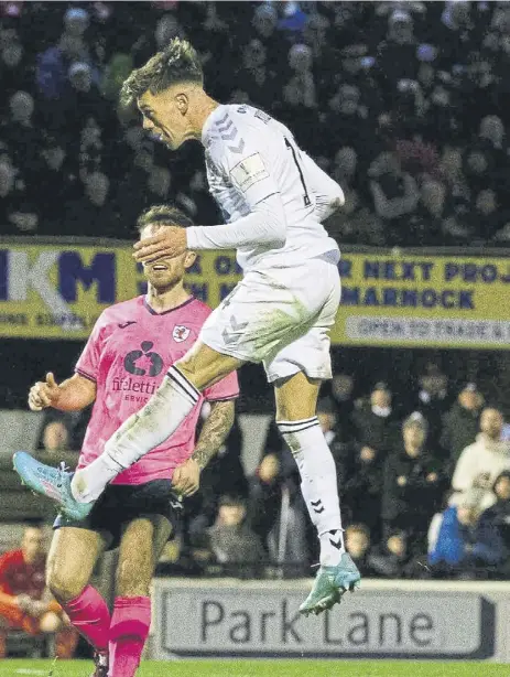  ?? ?? ← Ayr’s Josh Mullin rises high to head home the second goal against Raith Rovers at Somerset Park on Saturday