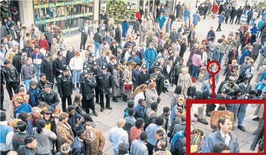  ??  ?? EIGHTIES UNREST: Police officers mingle with crowds in in Dudley Street, Wolverhamp­ton, following the death of Clinton McCurbin in 1987, an event David witnessed as reporter