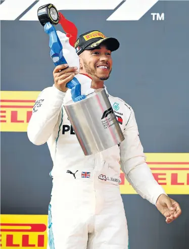  ?? Picture: MARK THOMPSON/GETTY IMAGES ?? PODIUM RETURN: Race winner Lewis Hamilton, of Great Britain and Mercedes GP, celebrates on the podium during the Formula One Grand Prix of France at Circuit Paul Ricard in Le Castellet, France, yesterday