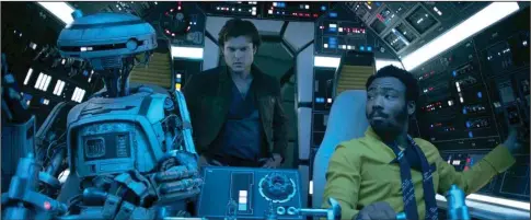  ?? Photo courtesy of Lucasfilm Ltd. ?? L3-37 (Phoebe Waller-Bridge), Han Solo (Alden Ehrenreich) and Lando Calrissian (Donald Glover) fly high in ‘Solo.’