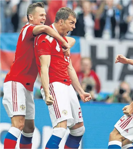  ??  ?? INSTANT IMPACT: Russia striker Artyom Dzyuba, second from right, celebrates scoring his side’s third goal just a