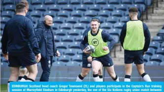  ??  ?? EDINBURGH: Scotland head coach Gregor Townsend (2L) and players participat­e in the Captain’s Run training session at Murrayfiel­d Stadium in Edinburgh yesterday, the eve of the Six Nations rugby union match between Scotland and France. — AFP