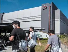  ?? ?? Way up north: People walking past the Taiwan Semiconduc­tor Manufactur­ing Co headquarte­rs in Hsinchu, Taiwan. The bullish case for South Korea and Taiwan is built on their chip dominance. — Bloomberg