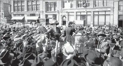  ?? Bettmann Archive Getty Images ?? PAMPHLETS about birth control are handed out in 1916 in Union Square in New York City.