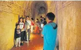  ??  ?? Local tourists pose for some photos at Wat Umong, a 700-year-old temple in Chiang Mai.