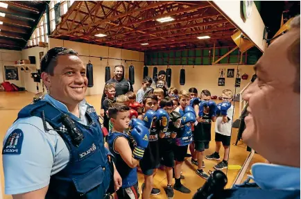  ?? MARTIN DE RUYTER/NELSON MAIL ?? Nelson Police Community Constable Jason Rangi helps out leaders at weekly fitness classes with youth at Victory Boxing.