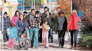  ?? [PHOTO BY STEVE GOOCH, THE OKLAHOMAN ARCHIVES] ?? Shoppers negotiate an outside environmen­t in 2013 as they look for bargains at what then was known as the Outlet Shoppes in Oklahoma City. On Monday, the project’s new owners announced a new name for the developmen­t: OKC Outlets.