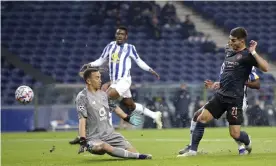  ?? Photograph: Luis Vieira/AP ?? Porto goalkeeper Agustín Marchesín saves from Ferran Torres on a frustratin­g night for Manchester City.