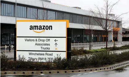  ?? ?? One worker inside the Amazon fulfilment centre in Tilbury posted a video accusing the company of treating them ‘like slaves’. Photograph: Gareth Fuller/PA