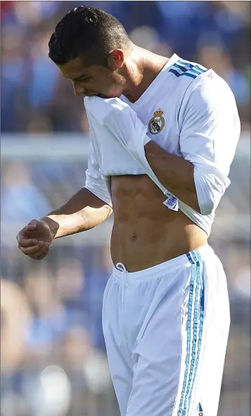  ??  ?? I’ve a long way to go before I have the Cristiano Ronaldo-style six-pack.