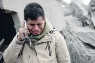  ??  ?? Boris Rodriguez, 24, who is searching for his wife, cries after seeing the condition of his neighborho­od, destroyed by the erupting Volcan de Fuego, or ‘Volcano of Fire’.