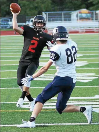  ?? RANDY MEYERS — THE MORNING JOURNAL ?? North Olmsted quarterbac­k Brandon Maximovich passes over Valley Forge’s Dovydas Sodys during the first quarter.