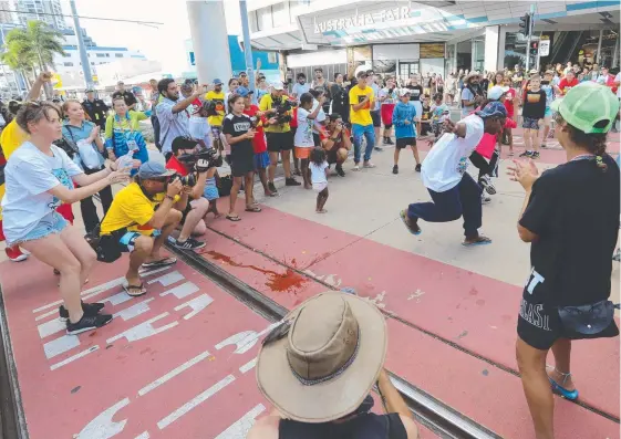  ??  ?? The protesters outside Australia Fair shopping centre in Southport yesterday afternoon. Pictures: ALEX COPPEL