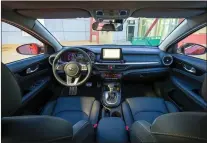  ??  ?? The Forte’s dash is horizontal in appearance with a 20-cm floating screen for the infotainme­nt system in the centre and a two-level tray beneath, the upper one providing a wireless charging pad.