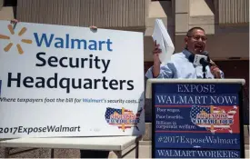  ?? MARK HENLE/THE REPUBLIC ?? Maricopa County Supervisor Steve Gallardo speaks during a Walmart protest on Monday.