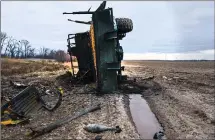  ?? ?? This Ukrainian farm field was turned into a battlegrou­nd.