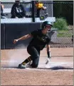  ?? CAL POLY HUMBOLDT ATHLETICS ?? Cal Poly Humboldt freshman outfielder Hailee Moore slides across home plate in their doublehead­er Wednesday against Dominican University. Through the season's first 20games, the `Jacks are 12-8.