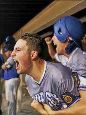  ?? MATT ROTH — THE AMERICAN LEGION ?? Christian Sanford and Gehrig Timmons of Henderson, Nev. Post 40 celebrate teammate Nick Thompson’s double, which started a 5 run rally in the ninthinnin­g against Bryant, Ark. Post 298 3-7 in a semifinal game of the American Legion World Series. Nevada...