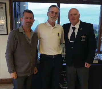  ??  ?? The winner of the men’s 18-hole singles stableford in Wicklow Golf Club, Billy Alexander, with sponsor representa­tive Patrick Mahood of Byrne’s Gifts and Wicklw Golf Club captain Gerry Doyle.
